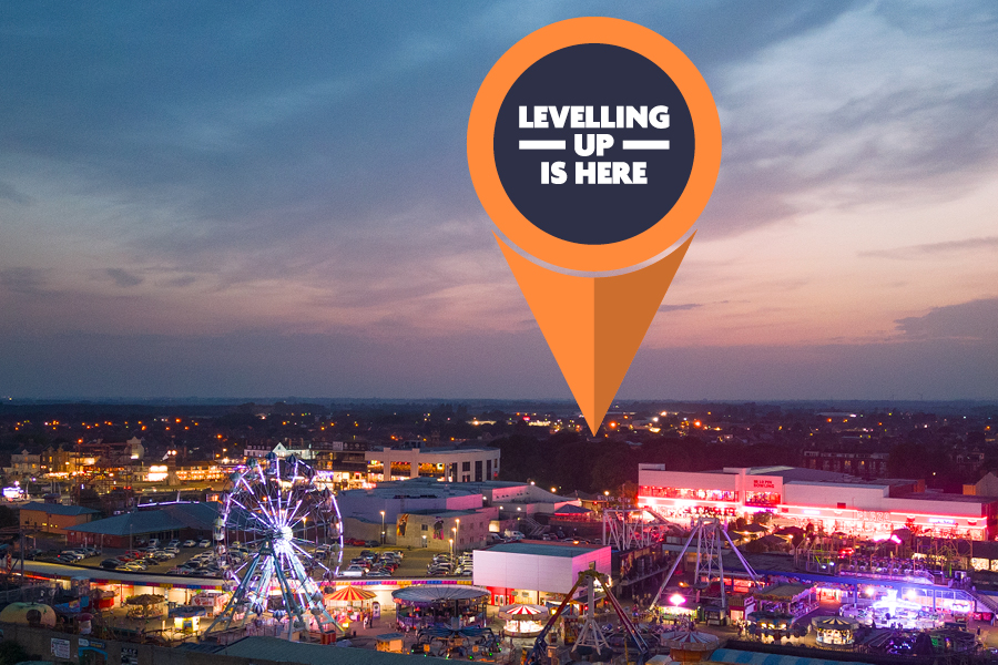 Levelling Up logo shown pinned to a photo of Skegness at night