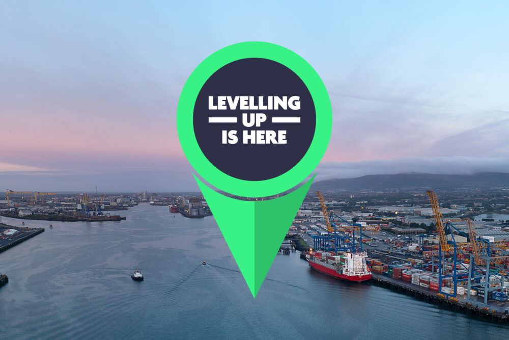 Levelling Up logo shown pinned to a photo of Belfast Harbour